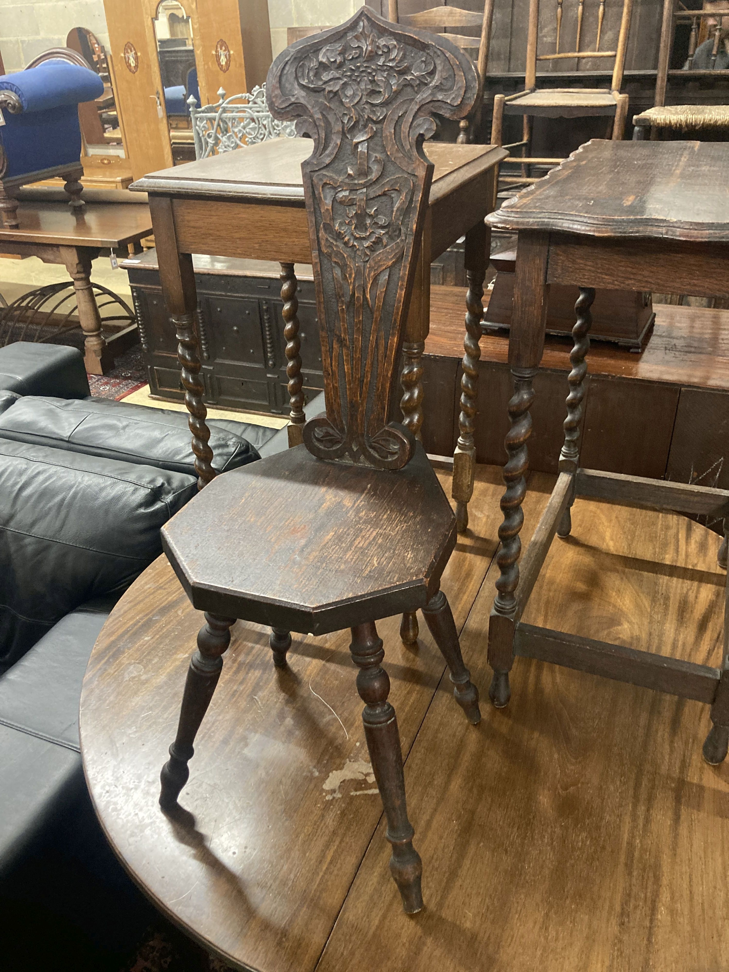 Two 1920s oak occasional tables, larger width 60cm, depth 37cm, height 72cm, together with a carved oak spinning chair